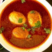 Egg Curry · Indian street style curry that contains hard boiled eggs simmered in a rich aromatic tomato ...