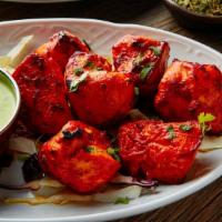 Chicken Tikka · Chunks of boneless chicken marinated in yogurt & Indian spices, then baked on skewers in our...