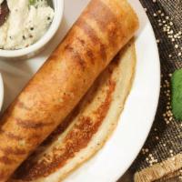 Plain Dosa · Thin savory crepe made of fermented rice & lentil batter served with white coconut chutney &...
