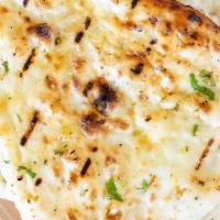 Tandoori Naan · Leavened flatbread made of all purpose flour & baked in our clay oven (tandoor) (Vegetarian,...