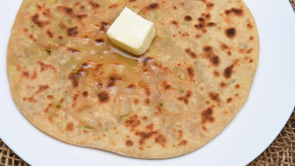 Plain Parantha · Round flat unleavened whole wheat bread fried on a griddle; Vegan when served without butter (Vegetarian, Vegan, Nut-Free)