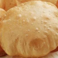Puri · Deep-fried fluffy bread made from unleavened whole-wheat flour (Vegetarian, Nut-Free)