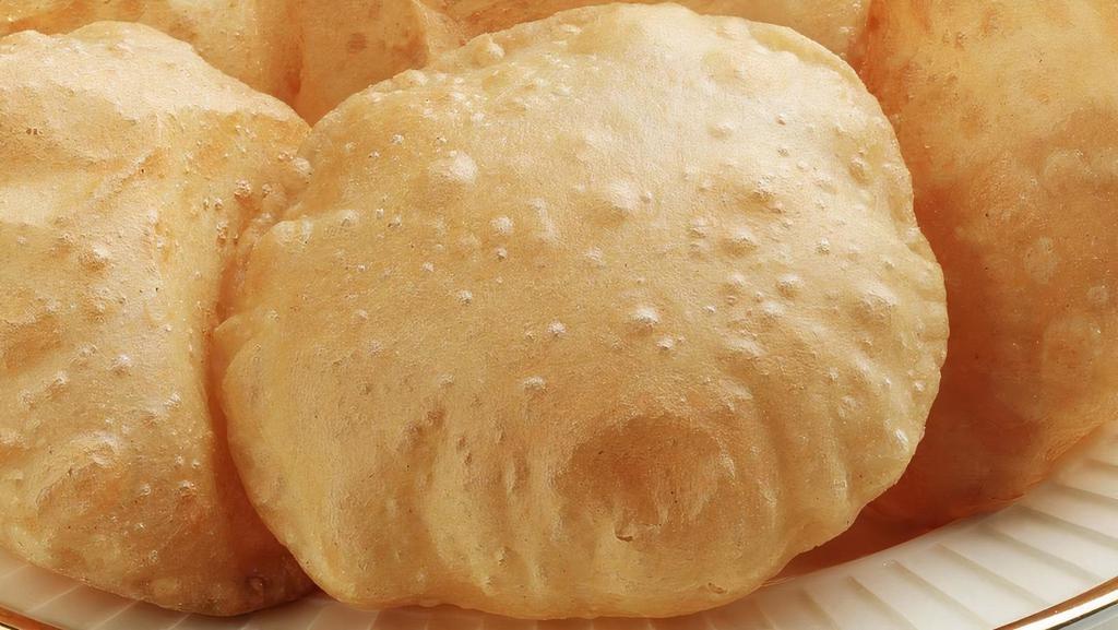 Puri · Deep-fried fluffy bread made from unleavened whole-wheat flour (Vegetarian, Nut-Free)