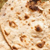 Tandoori Roti · Round unleavened bread made of whole wheat flour & baked in our clay oven (tandoor) (Vegetar...