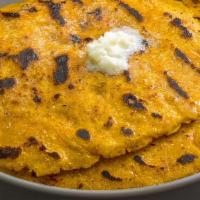 Makki Ki Roti · (1pc) Unleavened cornmeal bread cooked on a skillet; vegan when served without butter on top...