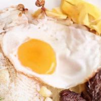 Bisteak A La Limena · Sirloin steak served with rice, French fries, plantain and fried egg.
