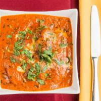 Butter Chicken · Charbroiled chicken simmered in a creamy tomato based gravy