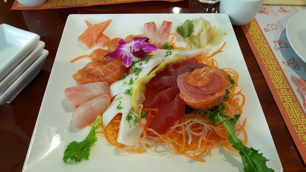 Sashimi Appetizer · Two tuna two salmon, and two white fish.