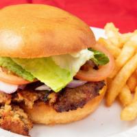 Chicken Chapli Burger · Lettuce, Tomatoes, Caramelized Onions and Mayo with American Cheese.