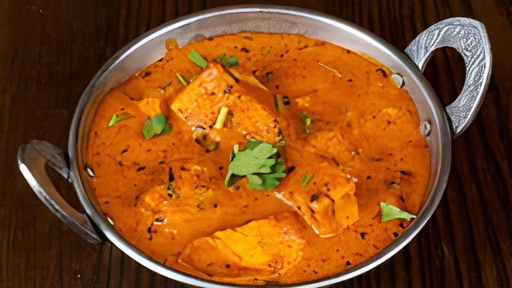 Chicken Tikka Masala · An all-time international favorite- Cooked with a marinated piece of meat in a creamy tomato-based broth
