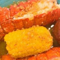 Lobster Tails(2) · served with potatoes and corn then blended with one of our signature seasoning you choose.