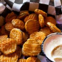 Inna Pickle · Our hand battered fried pickles with cherry peppers and our house made ranch dressing