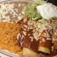 #7 Enchiladas · Two corn tortillas stuffed with chicken or beef.