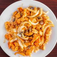 Arroz Con Pollo · Boneless chicken breast sautéed in a special sauce with onion, mushrooms and cheese dip on t...