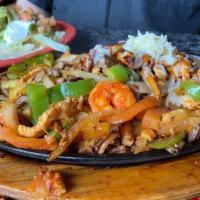 Acapulco Fajitas · Chicken, shrimp, chorizo, and steak cooked with bell peppers, mushrooms, onion, and tomato. ...