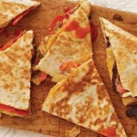 #1. Fajita Quesadilla · A flour tortilla stuffed with grilled steak or chicken, onion, peppers, and cheese.