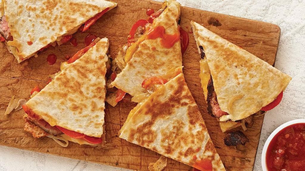 #1. Fajita Quesadilla · A flour tortilla stuffed with grilled steak or chicken, onion, peppers, and cheese.
