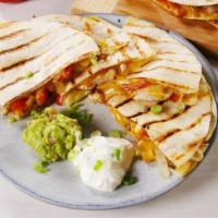#4. Grilled Chicken Quesadilla · A grilled flour tortilla stuffed with grilled chicken breast.