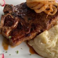 T-Bone Steak · 16 oz t-bone marinated in house spices, topped with onion straw. Served with a side of mashe...