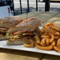 Buffalo Chicken Sandwich · Buffalo chicken, lettuce, tomatoes and bacon drizzled with bleu cheese dressing. Served on a...