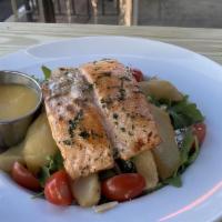 Salmon Pear Goat Cheese Salad · Baby arugula tossed with homemade champagne vinaigrette and topped with grilled salmon, cher...
