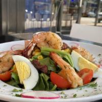 Mango Shrimp Salad · Baby spinach tossed with mango vinaigrette topped with sweet corn, boiled egg, cherry tomato...