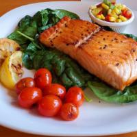 Bistro Grilled Salmon · Grilled salmon served over fresh spinach. Roasted tomatoes and succotash on the side.