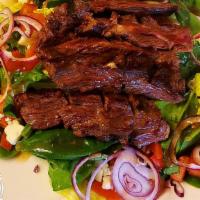 Grilled Skirt Steak Salad · Grilled skirt steak, mixed greens, roasted tomatoes, red onions, crumbled blue cheese, crout...