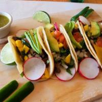 Signature Tacos (3) · 3 tacos with chicken, steak, or ground beef. Served with mango, radish, tomatoes, onions, av...