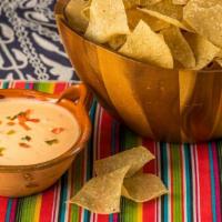 The Box Of Queso · Chihuahua Queso, Fresh Fire Roasted Salsa, and Crispy House Tortilla Chips all in Your Box!