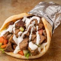 Lamb Gyro · Ground lamb mixed with a selection of the finest herbs and spices, cooked as perfect tender ...