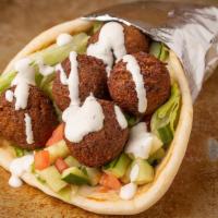 Falafel Gyro · Freshly cooked all vegetarian balls, deep fried to perfection, consisting of ground chick pe...