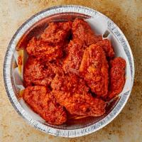 Fire Wings · Cooked wing of a chicken coated in sauce or seasoning.