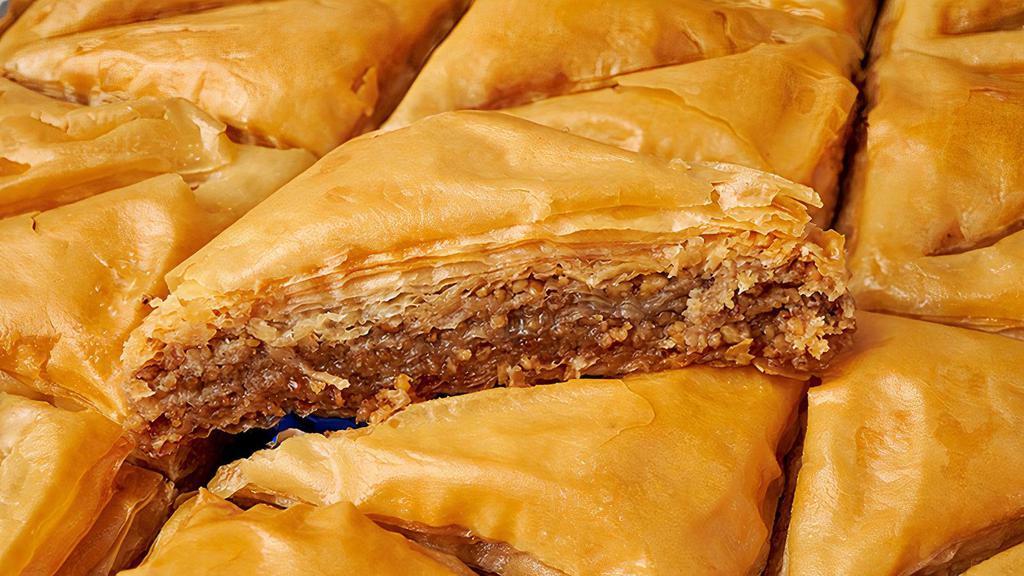 Baklava · Delicious desert pastry filled with almonds and pistachios, covered in honey