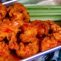 Boneless Wings · Jumbo Wings coated in your favorite sauce served with ranch and celery.