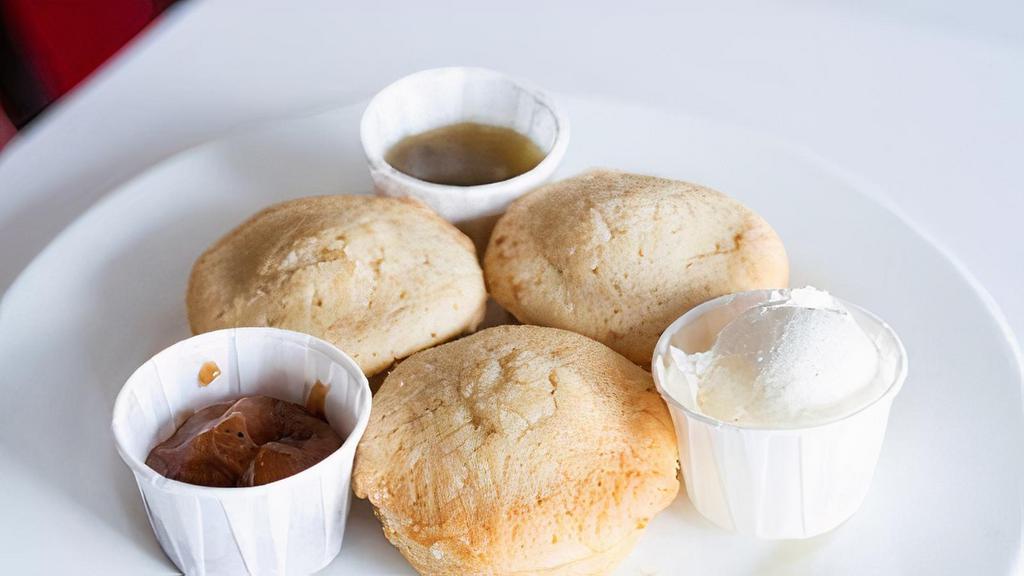 -Cornbread Muffins- · Three corn bread muffins served with whipped butter, apple butter and green-chile jam.