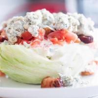 -Wedge Salad- · Iceberg lettuce, tomato, bacon, bleu cheese, buttermilk ranch dressing.