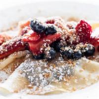 -Crepes- · Three crepes stuffed with Nutella and topped with marinated berries, walnut streusel, and po...