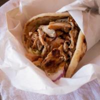 Chicken Shawarma Sandwich · Marinated strips of chicken, charbroiled on open fire, topped with garlic sauce, lettuce, on...