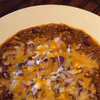House Made Chili · Ground Beef Chili With NO Beans Topped With Shredded Cheese Red Onion And Sour Cream