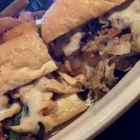 Cheesesteak · Shaved Ribeye or Chicken With Provolone Cheese Fried Onion Lettuce Tomato And Mayo