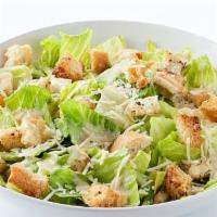 Caesar Salad · Romaine Lettuce, Shaved Parmigiana,
Seasoned Croutons.