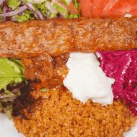 Adana Kebab Bowl · Turkish bulgur pilva and mixed greens with adana skewers, red cabbage slaw, turkish salad, s...