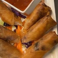 Veggies Egg Rolls · Deep-fried veggies and grass noodle rolls served with sweet and sour sauce.
