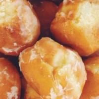 Glazed Donut Holes · Yeast-raised glazed donut holes are the perfect bite size treats!