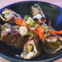 Mandu Vegetarian ( Korean Dumplings) · Vegan mandu pan fried dumplings served with gochujang soy sauce.