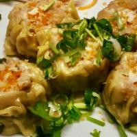 Steamed Dumpling · Steamed dumplings stuffed with shrimp, crabmeat, pork, water chestnuts and Thai herb served ...