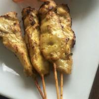 Chicken Satay · Skewered chicken marinated in herbs, grilled and served with peanut sauce.