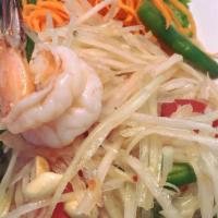 Papaya Salad Deluxe · Mild. Julienne green papaya, roasted peanuts and string beans tossed with spicy lime juice; ...