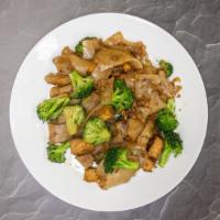 Pad See Eew · Stir-fried wide rice noodles with egg, broccoli in a black bean sauce.
